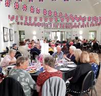 Guests at dining tables with Union Jack bunting