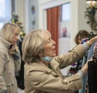 Owners browsing clothes on rack