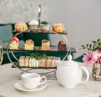 Afternoon Tea with sparkling wine, teapot and cake stand