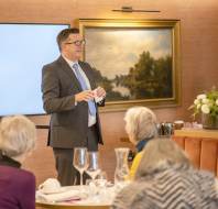 Man in suit beginning a presentation