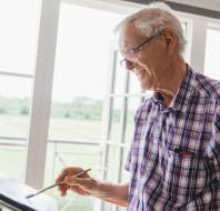 Owner painting in a retirement village