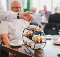 Afternoon tea with cake stand and china teapot