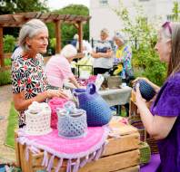 Customer talking with crochet stall owner