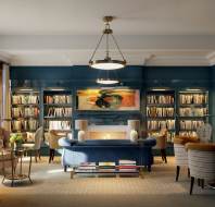 Bookshelves, paintings and cosy seating