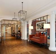 Elegant lobby with ironwork and parquet floor
