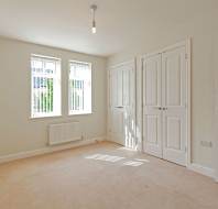 Large bedroom with white walls