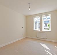 Large bedroom with white walls