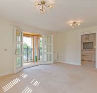 Living room with open balcony doors