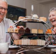 Two people enjoying afternoon tea