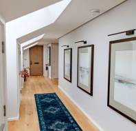 Hallway with wood floor and rooflight