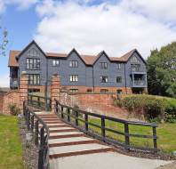 Gated stairway leading to modern apartment block