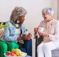 Two women chatting over coffee