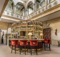 Island bar under grand stairwell