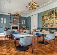 Elegant bistro with large wall painting