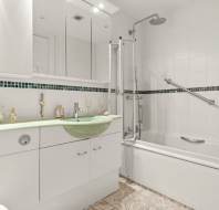 White and green tiled bathroom