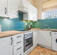 Kitchen with green tiles