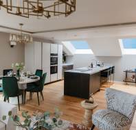 Fitted kitchen in open-plan penthouse