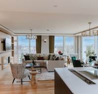 L-shaped sofa and dining table with view on two sides