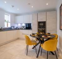 Dining area with mustard chairs
