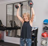Owner working out in the gym at Audley Redwood