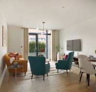 A modern living room with a seating area, dining table, and wall-mounted TV. Large windows let in natural light, and potted plants decorate the space.