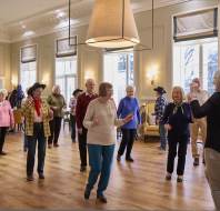 Homeowners line dancing together at Mote House Bearsted retirement village
