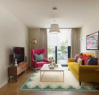 A modern living room with a yellow sofa, pink armchair, coffee table, and TV. Decor includes patterned cushions, a floral wall art piece, a floor lamp, and a large window with curtains.