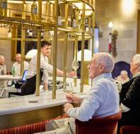 Homeowners enjoying a drink together in the bar at Sunningdale Park