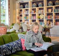 Homeowners relaxing in the library at luxury Ascot retirement village