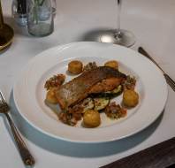Summer menu - Pan seared sea trout fillet served with grilled courgette, tomato salsa and rosti potato (GF)
