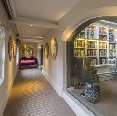 Period hallway with large window into library