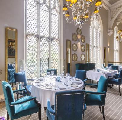 Restaurant tables in grand Victorian dining room