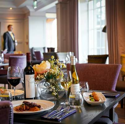 Restaurant table with wine and fine food