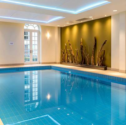 Blue swimming pool and gold wall art