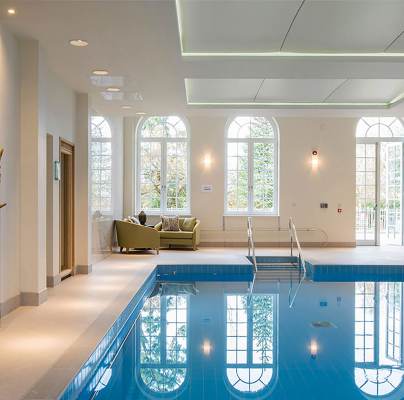Indoor pool with large picture windows