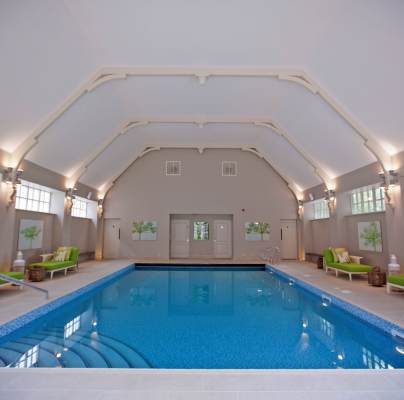 Indoor swimming pool with an arched ceiling