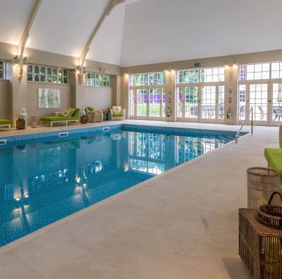 Indoor swimming pool with an arched ceiling