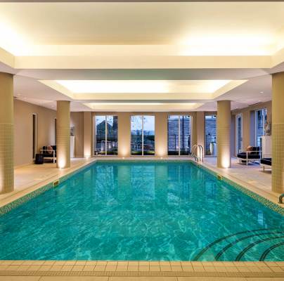 Indoor swimming pool with soft lighting