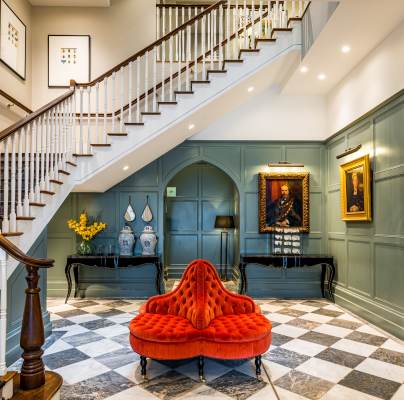 Panelled entrance hall with grand staircase