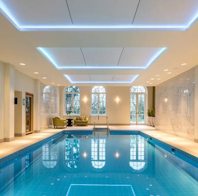 Indoor pool with golden wall art