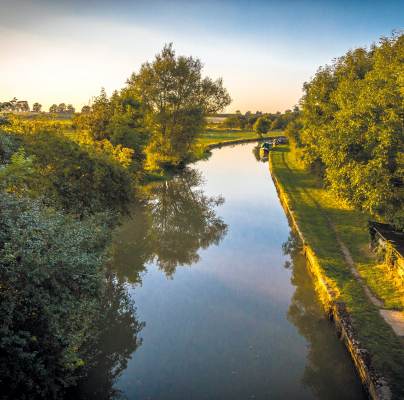 A canal with trees on a summer day