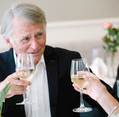 Senior couple drinking a toast