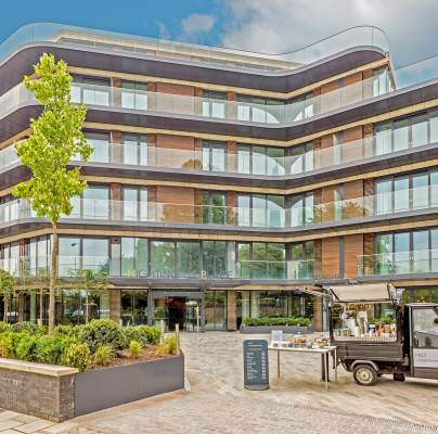 Exterior of a glass building with apartments