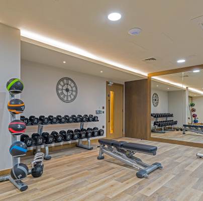 Gym with weights and large mirrors