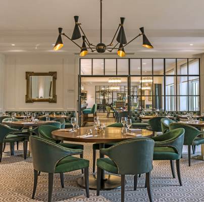 Luxury restaurant with green chairs