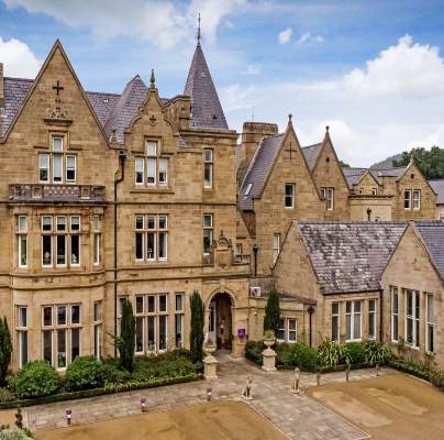 Aerial front view of a Victorian Gothic building