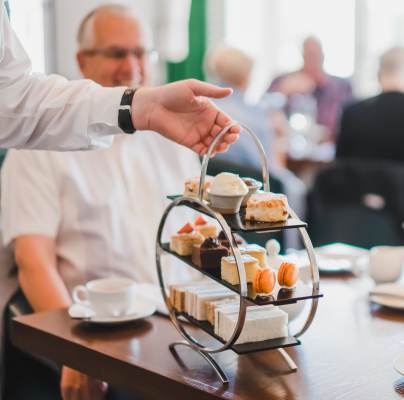 Afternoon tea with cake stand and china teapot