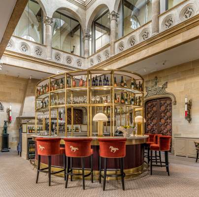 Island bar under grand stairwell