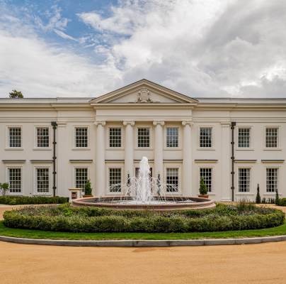 Mansion with wide drive and fountain