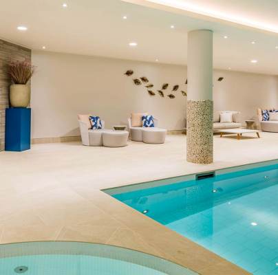 Indoor swimming pool with loungers